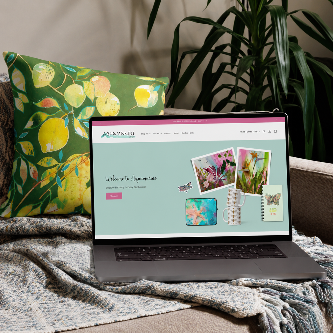 Custom Shopify website for Aquamarine Design Studio by mixed media artist Tania Herrera displayed on a laptop, featuring nature-inspired artwork, an art and lifestyle brand, and a serene online shopping experience.